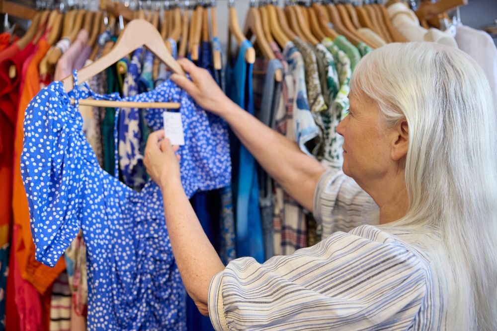 woman looking at clothes in a store